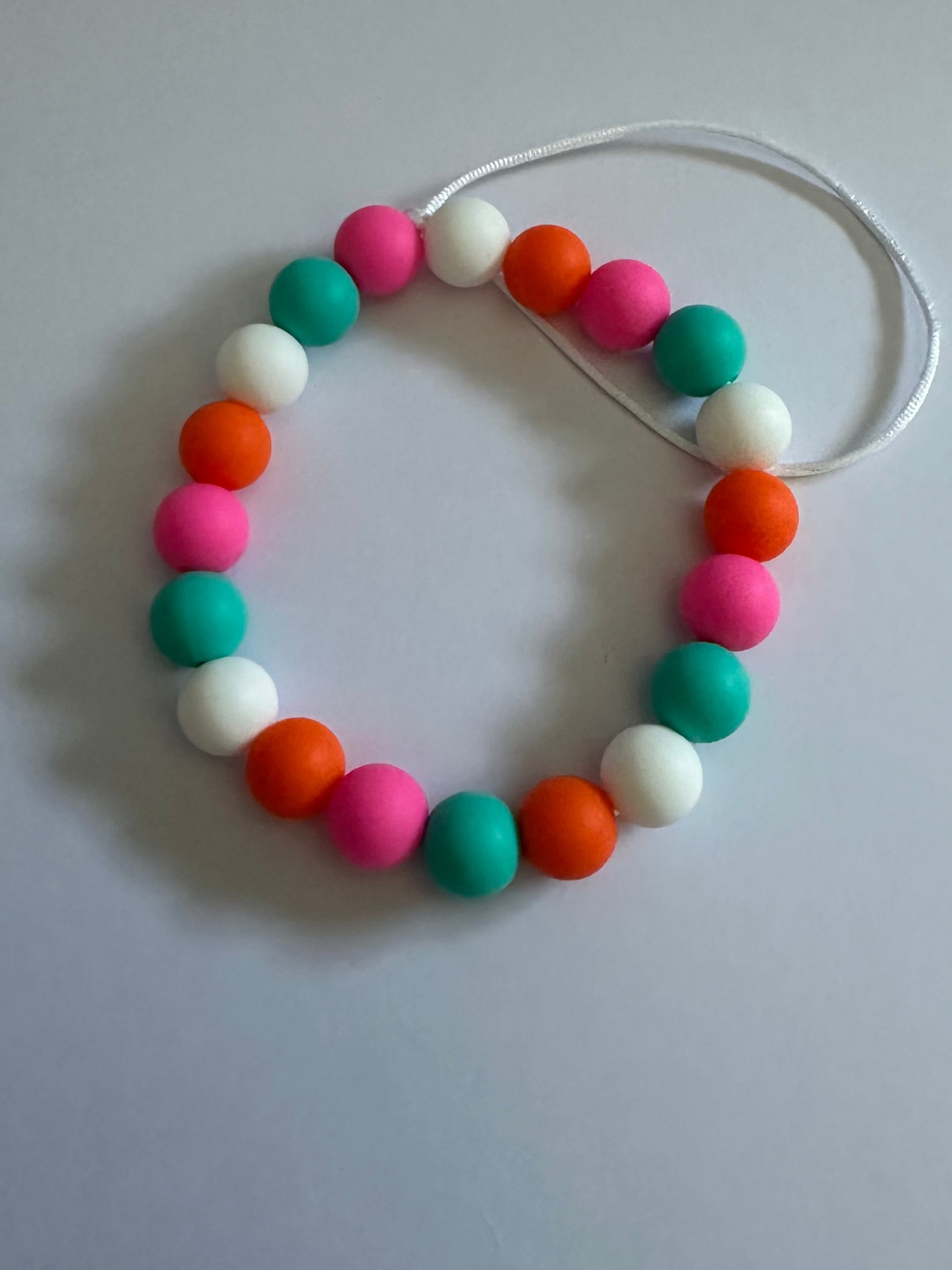 Wristlet phone charm